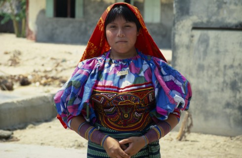 PANAMA, San Blas Islands Tikantiki , Kuna Indians, Kuna girl wearing traditional layered applique