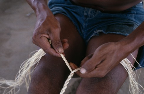 COLOMBIA, North West Amazon, Tukano Indigenous People, Close-up of Makuna man making cumare palm
