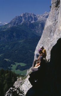 AUSTRIA, Salzburg, Eisriesenwelt, "Group of hikers at cave entrance near Werfen looking out over