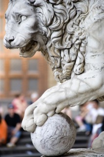 ITALY, Tuscany, Florence, "Sculpture of a lion with its paw on a cannon ball at the entrance to the
