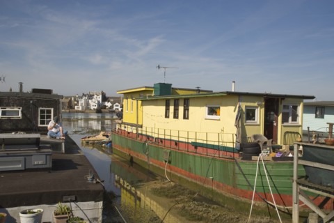 ENGLAND, West Sussex, Shoreham-by-Sea, Houseboat moored along the banks of the river adur.  Former