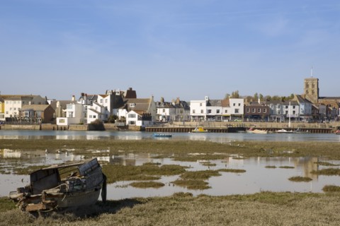 ENGLAND, West Sussex, Shoreham-by-Sea, View across the river Adur mud flats toward the won centre.