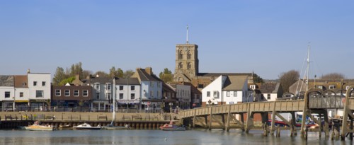 ENGLAND, West Sussex, Shoreham-by-Sea, View across the river Adur mud flats toward the won centre.