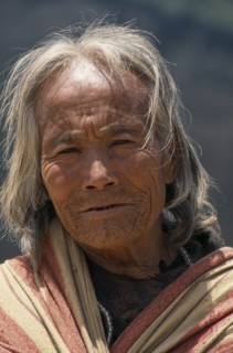 NEPAL, Lower Dolpo Trek, Gomba , Head and shoulders portrait of elderly woman in Gomba Village