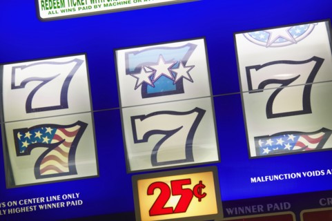 20091068 Detail slot machine dials showing lucky number seven 25 cents play. Gambling  Casino 7 American North America United States America  Region - North AmericaLeisure ActivitiesDominant Blue Jo...
