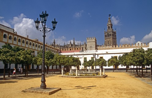 SPAIN, Andalucia, Seville, Cathedral and Patio de Banderas.