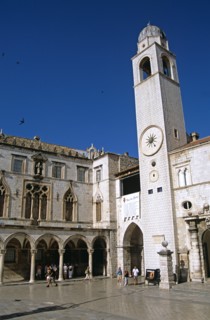 CROATIA, Dalmatian Coast, Dubrovnik, "Bell tower and Sponza Palace, Luza Square, Stradun. Former