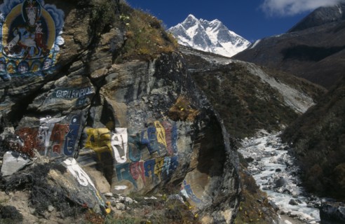 NEPAL, Everest Trek, Pangboche, Buddhist wall paintings beside the trail between Pangboche and