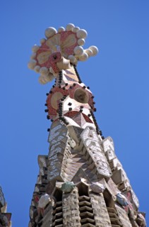 SPAIN, Catalonia, Barcelona, La Sagrada Familia colourful cathedral steeple detail.