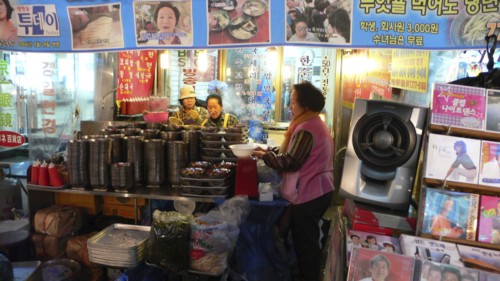 KOREA, South, Seoul, "Namdaemun market, street restaurant, women getting ready for the evening's