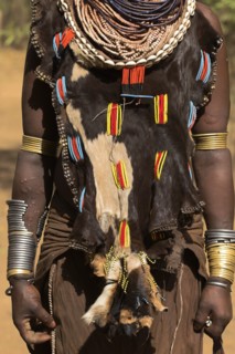 ETHIOPIA, Omo Valley, Mago National Park, Womans necklaces and traditional goatskin dress decorated