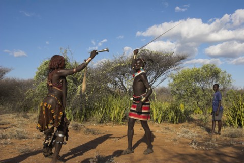 ETHIOPIA, Lower Omo Valley, Tumi, "Hama Jumping of the Bulls initiation ceremony. Man whipping