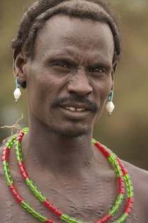 ETHIOPIA, Lower Omo Valley, Village near Omorate, Dassanech man