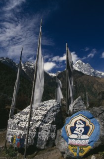 NEPAL, Everest Trek, Ghat, Mani Stones and Prayer Flags in Ghat Village.