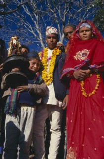 NEPAL, East,  Sangawa Khola, Bride and groom during wedding procession. Groom wearing a marigold