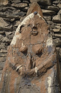 NEPAL, Annapurna Region, Jharkot, Circuit Trek. Female animistic protector deity beside the gateway