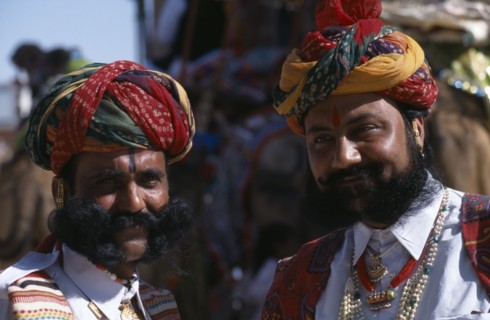 INDIA, Rajasthan, Bikaner, Two Rajput men with beards wearing ceremonial dress and turbans at the