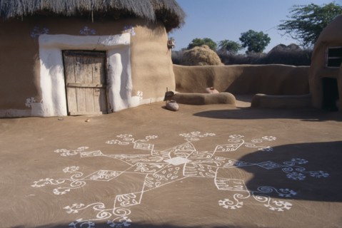 INDIA, Rajasthan, Katariasar, Village hut decorated for the Camel Festival with white painted