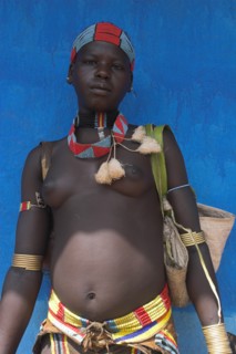 ETHIOPIA, Lower Omo Valley, Key Afir, Tsemay woman traditionally dressed at weekly market