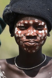 ETHIOPIA, South Omo Valley, Mursi Tribe, Boy with face painting