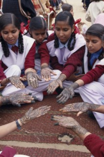 INDIA, Rajasthan, Nawalgarh, Schoolgirls displaying henna designs on their hands in the Mehndi