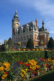 FRANCE, Nord Picardy, Pas-de-Calais, "Calais, colourful flowers and Town Hall."