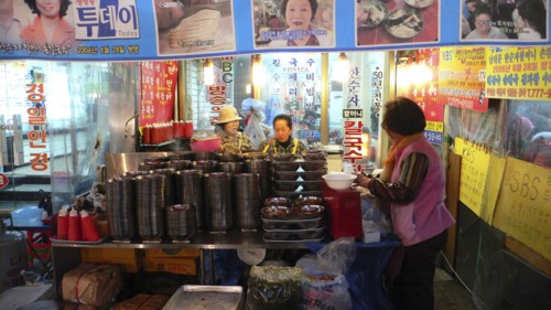 KOREA, South, Seoul, "Namdaemun market, street restaurant, women get ready for evening's customers