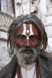 INDIA, Rajasthan, Udaipur, "Head and shoulders portrait of elderly male Hindu beggar in front of