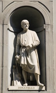 ITALY, Tuscany, Florence, Statue of the sculptor Donatello in the Vasari Corridor outside the