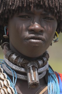 ETHIOPIA, Lower Omo Valley, Key Afir, Banner woman wearing a necklace know as a Bignere - an metal