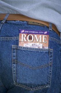 ITALY, Lazio, Rome, "The Eternal City of Rome guide book in tourists pocket,."