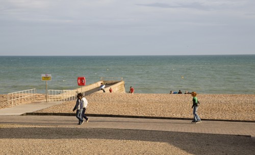 ENGLAND, East Sussex, Brighton, Rollerblading on the seafront promenade.
