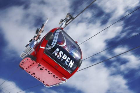20091058 View cable car ski lift against blue sky with clouds. North America United States America White  WeatherTravelTransportDominant RedDominant WhiteDominant BlueRegion - North America Jon ...