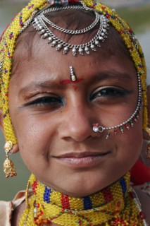 INDIA, Rajasthan, Jodhpur, Portrait of a young Indian girl at Meherangarh Fort wearing nose ring