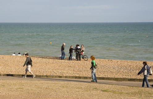 ENGLAND, East Sussex, Brighton, Rollerblading on the seafront promenade.