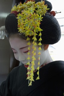 JAPAN, Honshu, Kyoto, Gion District.  Portrait of a Maiko apprentice Geisha with white painted face