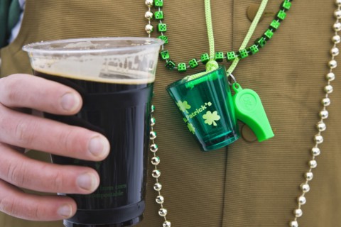 20091056 Detail man wearing various green items whilst drinking pint stout beer. Model Released American Male Men Guy North America One individual Solo Lone Solitary United States America  Dominant Gr...
