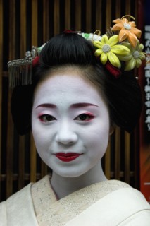 JAPAN, Honshu, Kyoto, "Gion District.  Head and shoulders portrait of smiling Maiko or apprentice