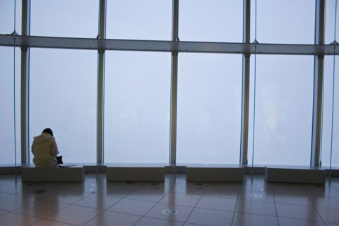 JAPAN, Honshu, Tokyo, Woman sitting alone at one of the benches in the Tokyo Art Museum and