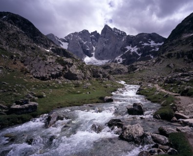 FRANCE, Midi-Pyrenees, Hautes-Pyrenees, "Upper Vallee de Gaube.  Fast flowing river tumbling over