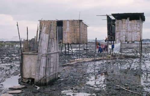 ECUADOR, Guayas Province, Guayaquil , Slum housing with stilt buildings built over untreated sewage