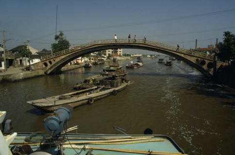 CHINA, Jiangsu Province, Transport, Barges travelling under bridge on the Grand Canal between