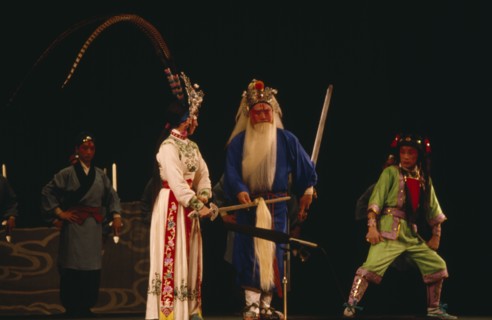 CHINA, Hebei, Beijing, Chinese Opera with male and female performers dressed in costume on stage