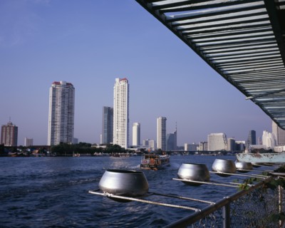 THAILAND, Bangkok, "Chao Phraya River from Wat Ratchasungkhon decorated with silver alms bowls,