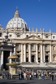 ITALY, Lazio, Rome, Vatican City The Basilica of St Peter with tourists at the entrance and in the