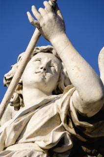 ITALY, Lazio, Rome, Statue of a winged female angel on the Ponte Sant Angelo bridge over the River
