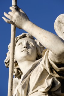 ITALY, Lazio, Rome, Statue of a winged female angel on the Ponte Sant Angelo bridge over the River
