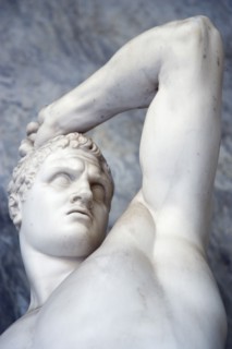 ITALY, Lazio, Rome, Vatican City Museums Statue of a man raising his arm in the Octagonal Courtyard
