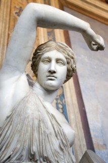 ITALY, Lazio, Rome, Vatican City Museums A statue of a woman raising her arm in the Room of The