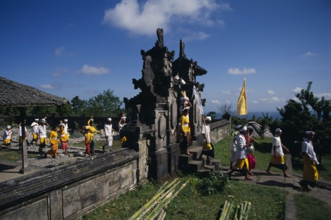 INDONESIA, Bali, Besakih Temple, Procession of mourners leaving cremation ceremony in temple